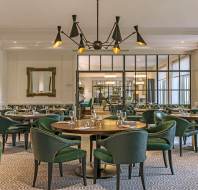 Luxury restaurant with green chairs