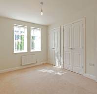Large bedroom with white walls