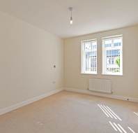 Large bedroom with white walls