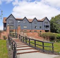 Gated stairway leading to modern apartment block