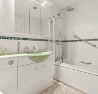 White and green tiled bathroom