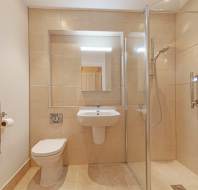 Shower room with peach tiles