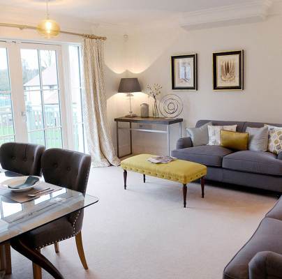 Lounge-diner in apartment with large windows
