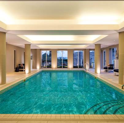Indoor swimming pool with soft lighting