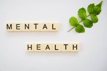 Mental health 'Mental health' spelled in Scrabble tiles