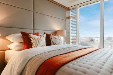 Close-up of double bed with view of London